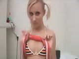 Sexy blonde inserting dildo