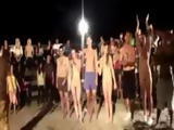 College students playing naked paintball