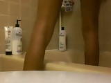Sexy black babe rides a big dildo on her bathtub