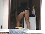MILF upskirt while cleaning the room