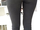 Sexy big ass of a saleswoman in tight jeans in an office