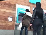 Beautiful arabic girl walking in the street in black leggins