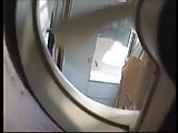 Tammy Li is spied taking shower through large exhaust fan 