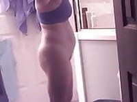 Busty MILF undresses for shower