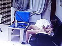 Naked girl in the living room with her mobile