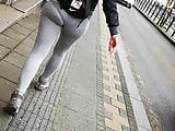 Girl in tights strolling down the street