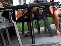 Frs sexy legs feets in shorts under table