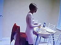 Naked blonde bakes at home in the kitchen