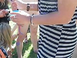 clothed girls do hand painting on a naked guy CFNM