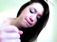 She gives him a blowjob and finishes him with a handjob